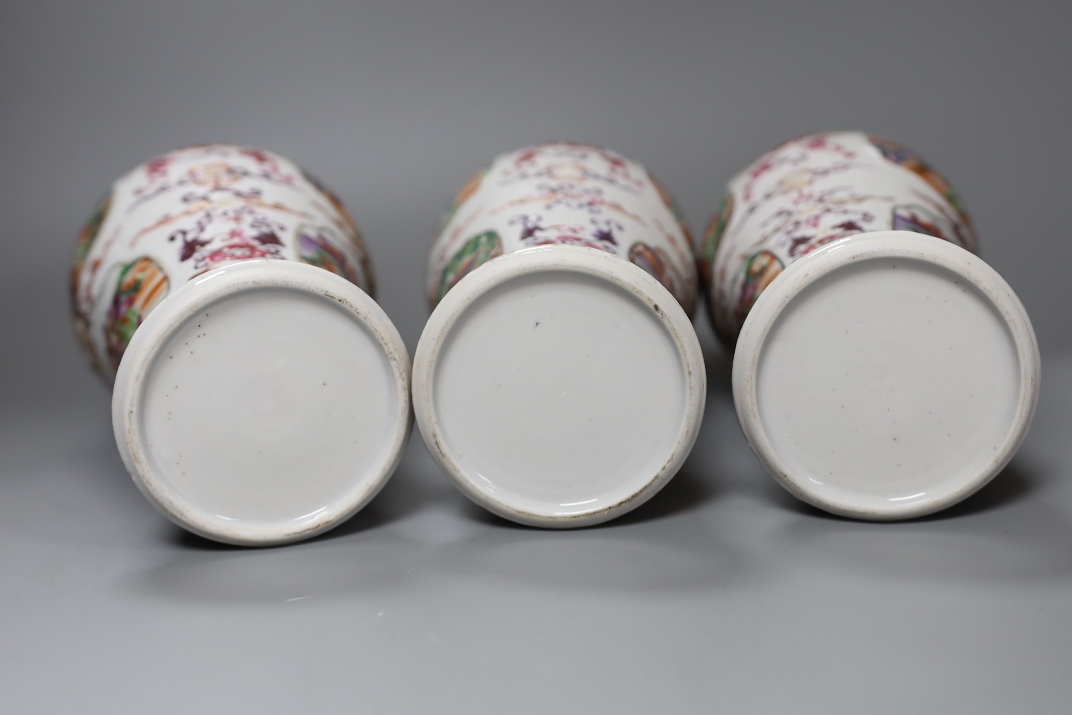 A set of three Qianlong famille rose baluster vases, 24.5cm tall
